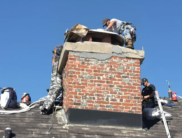 West Hartford Chimney Sweep installing a custom chimney crown in West Hartford, CT