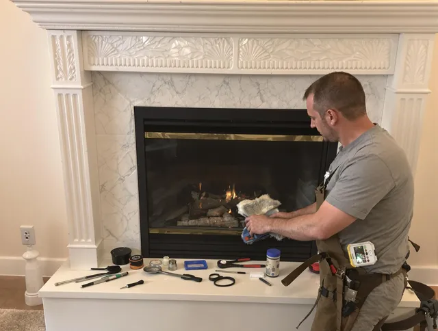 West Hartford Chimney Sweep performing fireplace maintenance in West Hartford, CT