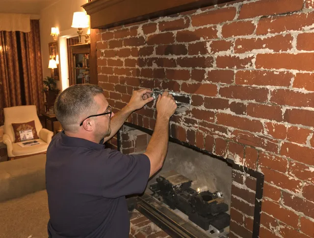 West Hartford Chimney Sweep expert fixing a fireplace in West Hartford, CT